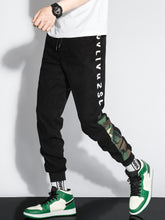 Charger l&#39;image dans la galerie, Love God. Store Men Pants Men Letter Camo Print Drawstring Waist Tapered Pants price
