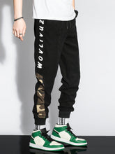 Charger l&#39;image dans la galerie, Love God. Store Men Pants Men Letter Camo Print Drawstring Waist Tapered Pants price
